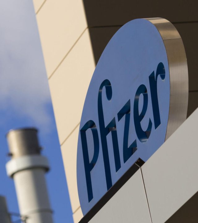 A sign for Pfizer pharmaceutical company is seen on a building in Cambridge, MA on March 18, 2017.